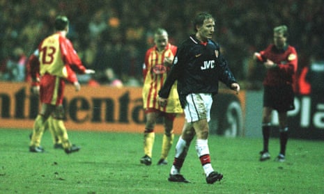 Ray Parlour leaves the pitch after receiving a red card from referee Anders Frisk.