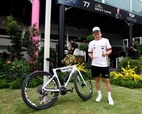 Valtteri Bottas poses with his bike after arriving Singapore at the end of a 418km ride from Malaysia