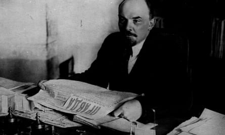 Lenin reading a newspaper, circa 1920.