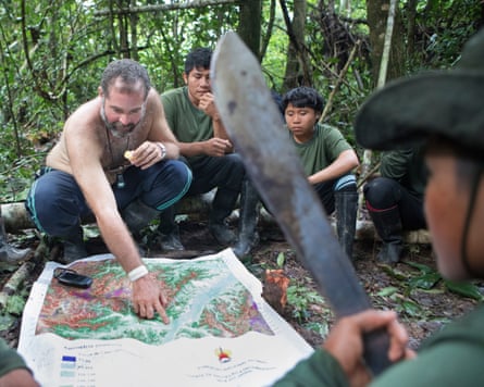 Bruno Pereira with map and Indigenous people in forest