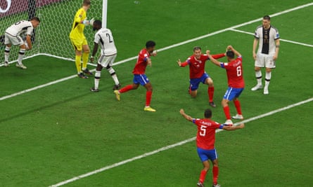 Costa Rica players celebrate their second goal against Germany