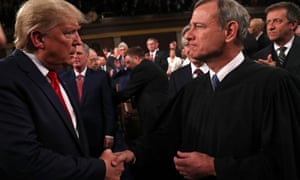 Trump shakes hands with the supreme court chief justice, John Roberts, before the State of the Union address last week