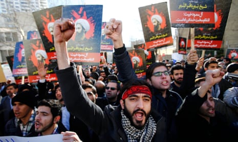 Iranian protestors hold posters of late Shia cleric Sheikh Nimr al-Nimr