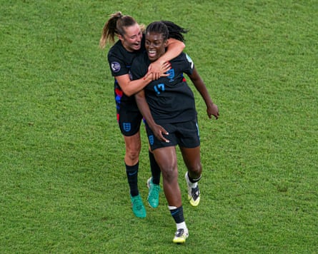 Ella Toone holds Michelle Agyemang around the shoulders as they run in an embrace
