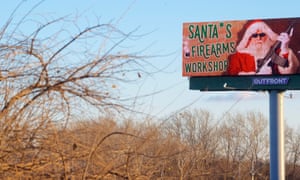 A digital billboard advertises a gun shop located in Easton, Pennsylvania.