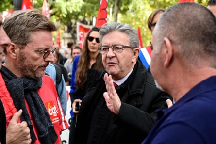 Jean-Luc Mélenchon talks with unionists in Marseille during a 2022 rally.