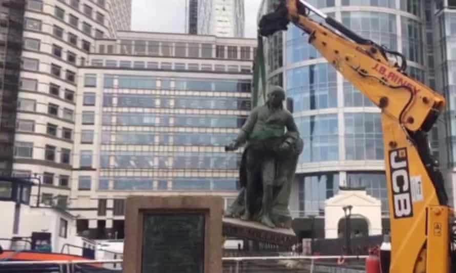 A statue of Scottish slaveholder Robert Milligan being removed from West India Quay, east London on Wednesday.