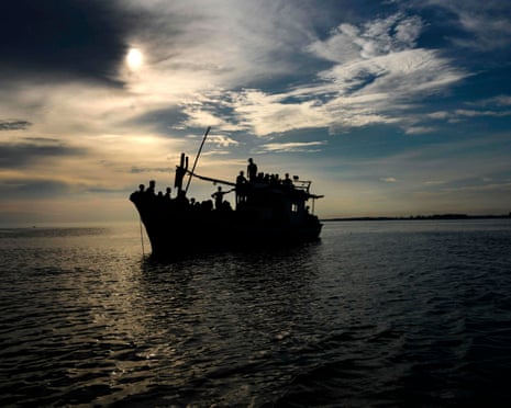 silhouette of a boat carrying rohingya