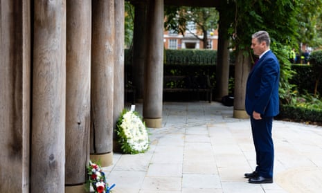 The Labour leader, Sir Keir Starmer, lays flowers in the September 11 Memorial Garden in Grosvenor Square, London, to mark the 20th anniversary of the terrorist attack.