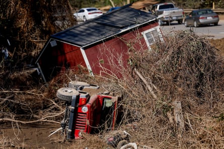 A damaged building and an overturned jeep.