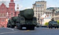 Military vehicles carrying ballistic missiles drive along Red Square on Sunday during a rehearsal for the Victory Day military parade.
