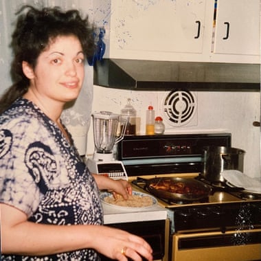Raj’s mother, Loretta cooking in the kitchen.