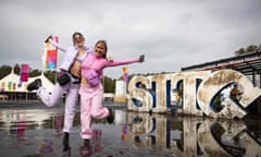 Festivalgoers pose for a photo in the mud during at Splendour in the Grass 2022 at North Byron Parklands on 23 July in Byron Bay