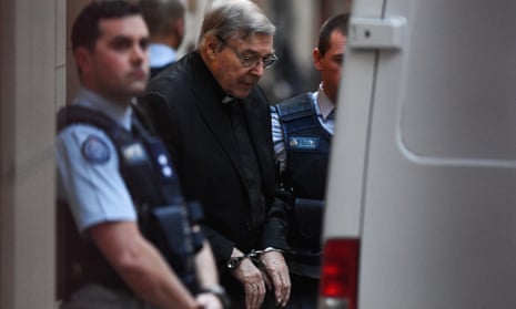 Cardinal George Pell in handcuffs