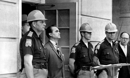 Governor George Wallace blocks the entrance to the University of Alabama in Tuscaloosa in 1963 to defy a federal order to desegregate the institution.