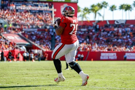 Tristan Wirfs grabs his touchdown against the Cardinals.