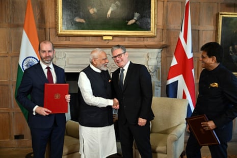 (L-R) Jonathan Reynolds, Narendra Modi, Keir Starmer and Piyush Goyal.