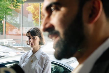 a woman looking at a man