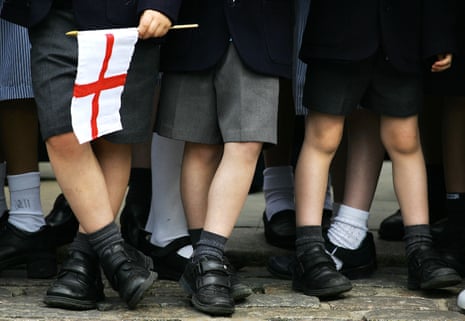 legs of schoolchildren with English flag
