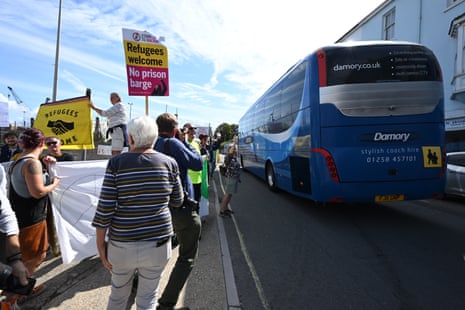 A coach arriving at the front gates at Portland Port, where the first asylum seekers being housed on the Bibby Stockholm are arriving today.