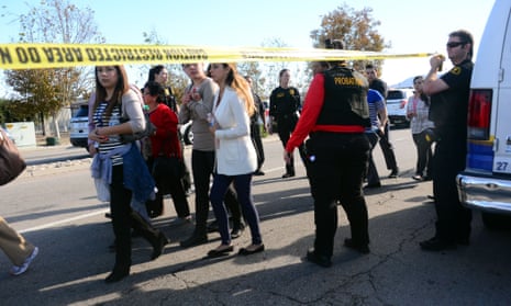 Survivors are evacuated from the scene of the shooting in San Bernadino, California. 
