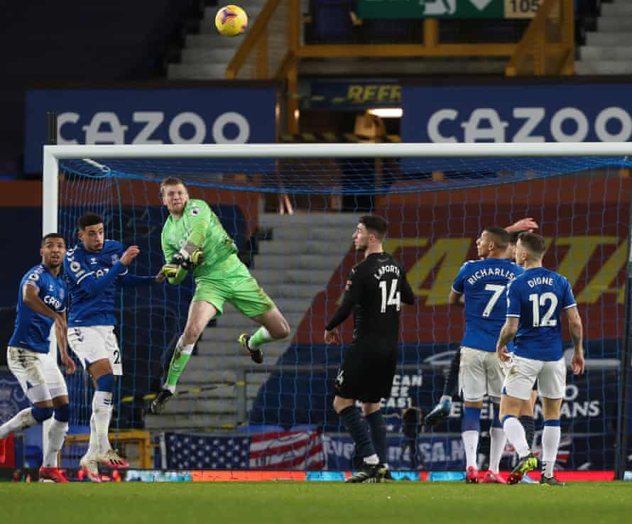 Everton keeper Jordan Pickford punches the ball clear.