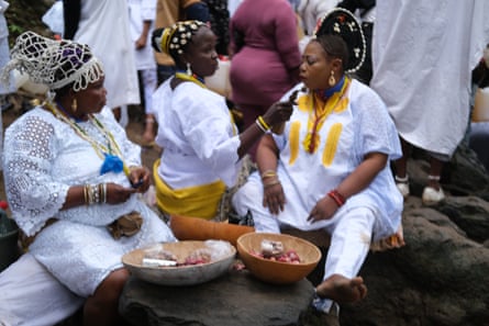 Osun priestesses wait for the worshipers to arrive.