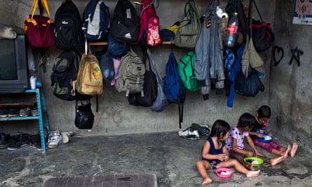 Children eat at a shelter for migrants in Chauites, Oaxaca. Shelters for migrants have tripled in population since the Southern Border Plan started in 2014.