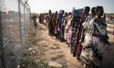 Women from the Murle ethnic group wait for a food distribution by the WFP Programme in Gumuruk, South Sudan. Conflict has led hundreds of thousands to flee their homes, compounding a food crisis.