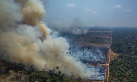 Smoke billowing from forest fires in the municipality of Candeias do Jamari, in Rondonia State, northwestern Brazil, on 24 August 2019.
