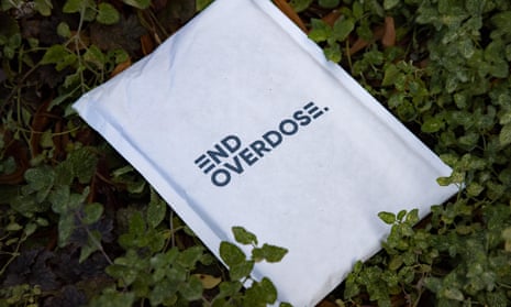 A bag containing Naloxone, a medicine that rapidly reverses an opioid overdose, is seen on the ground during a protest in Washington DC on 3 December.