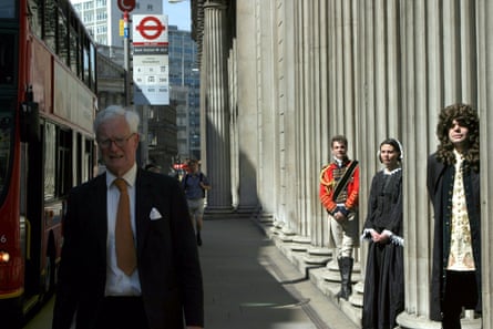 Actors dressed as the bank note stars the Duke of Wellington, Florence Nightingale and Sir Isaac Newton, with the politician Douglas Hurd passing by the Bank of England, in 2004.