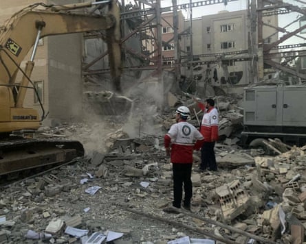 Rescue workers in a destroyed building