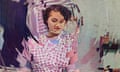 image of a woman in a housedress that appears to be from about the 1950s. the image is altered with concentric rings over it, as if a drop of water fell in a puddle