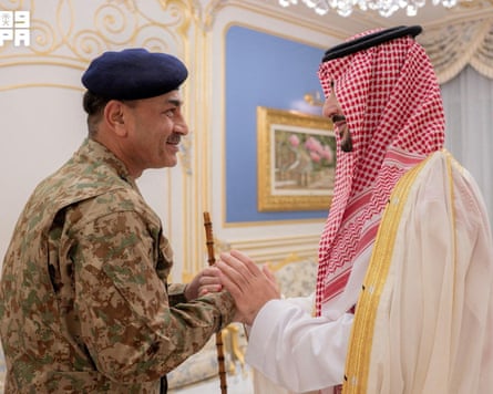 The Saudi defence minister, Khalid bin Salman, and Pakistan’s Field Marshal Asim Munir smile as they shake hands in an ornate room