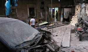 Medics inspect the damage outside a field hospital after in the rebel-held al-Maadi neighbourhood of Aleppo.