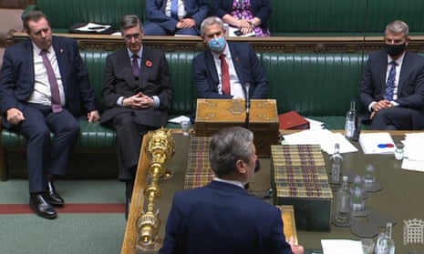 Labour leader Sir Keir Starmer speaks in the Commons during the debate on parliamentary standards as the Tory front bench look on.