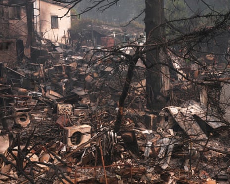 A house and belongings destroyed by a wildfire are photographed as the fire continues to spread near Pelayos de la Presa, Madrid province, Spain.