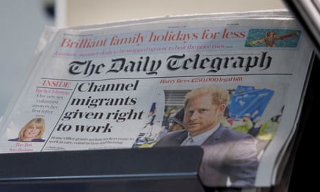 Copies of The Daily Telegraph are displayed on a rack in a supermarket in London in January.