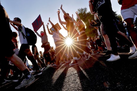 Sun shines between crowd of protesters