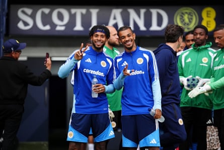 Curacao’s Leandro Bacuna (centre left) and Juninho Bacuna look pleased to be at Hampden Park.