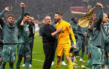 Tottenham’s head coach Ange Postecoglou, centre, celebrates with his players at the end of the Europa League quarter-final at Eintracht Frankfurt.