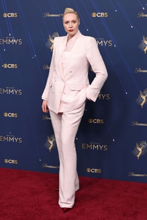 Gwendoline Christie looks fresher than a pitcher of milk in a Tom Ford suit and pointed, blood red shoes