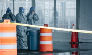 Medical professionals wait to take information from people at a mobile testing center in New Rochelle, New York, on 13 March.