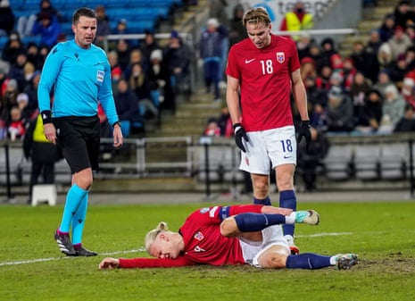 Erling Haaland goes down with an injury while in action for Norway