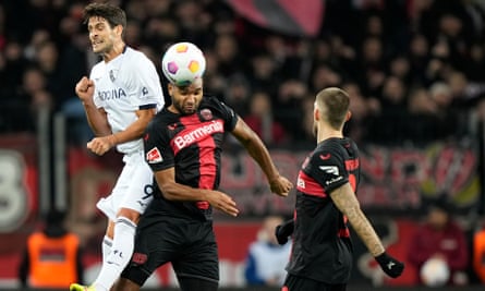 Bayer Leverkusen's Jonathan Tah (centre) beats Bochum’s Goncalo Paciencia (left) to the ball last month
