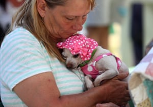 Cathy Kennedy of Petaluma, California, cradles her dog Precious