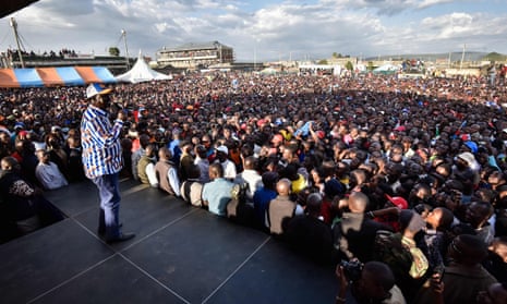 Raila Odinga speaks to supporters on a stage