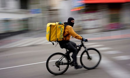 A Glovo food delivery courier in Madrid during the first wave of the pandemic