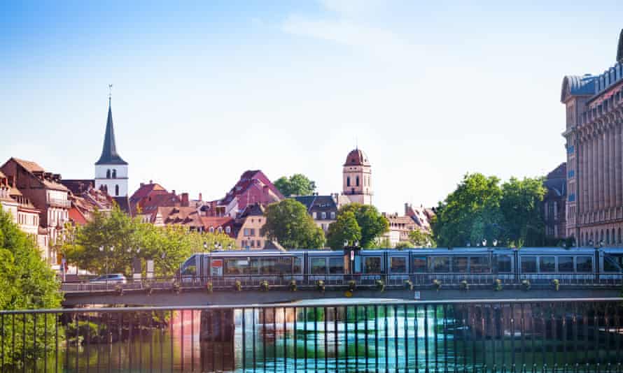 Light rail in Strasbourg with the St William and Madeleine churches in the background.